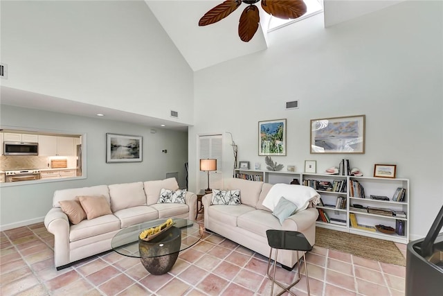 living room featuring ceiling fan and high vaulted ceiling