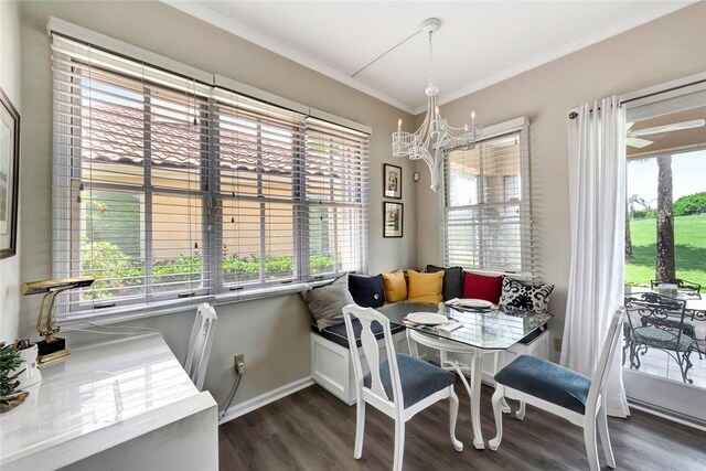 4851 N Newport Island Dr Unit 12A, Vero Beach, FL 32967 - dining room featuring a chandelier, plenty of natural light, dark wood-type flooring, baseboards, and ornamental molding