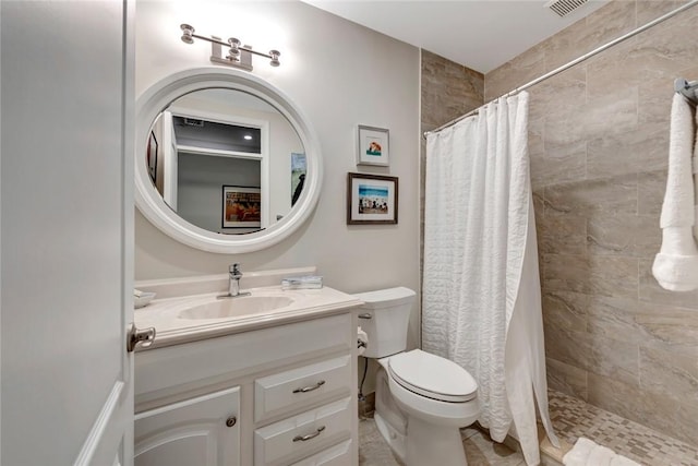 4851 N Newport Island Dr Unit 12A, Vero Beach, FL 32967 - bathroom with a tile shower, vanity, and toilet