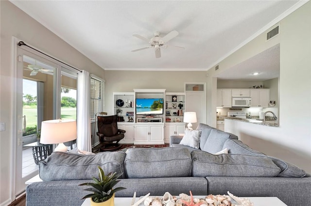 4851 N Newport Island Dr Unit 12A, Vero Beach, FL 32967 - living area featuring ceiling fan and ornamental molding