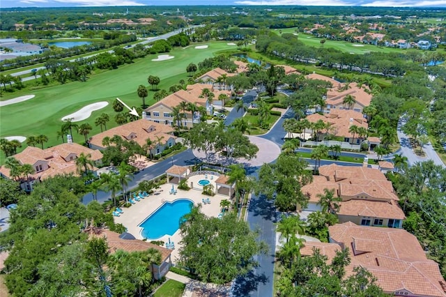 4851 N Newport Island Dr Unit 12A, Vero Beach, FL 32967 - aerial view of property and surrounding area featuring a golf course, a pool, and a nearby body of water