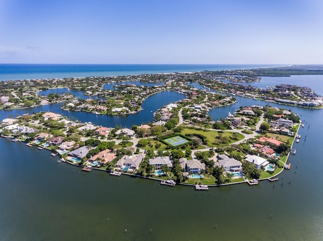 birds eye view of property with a residential view and a water view