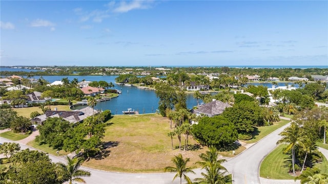 birds eye view of property featuring a residential view and a water view
