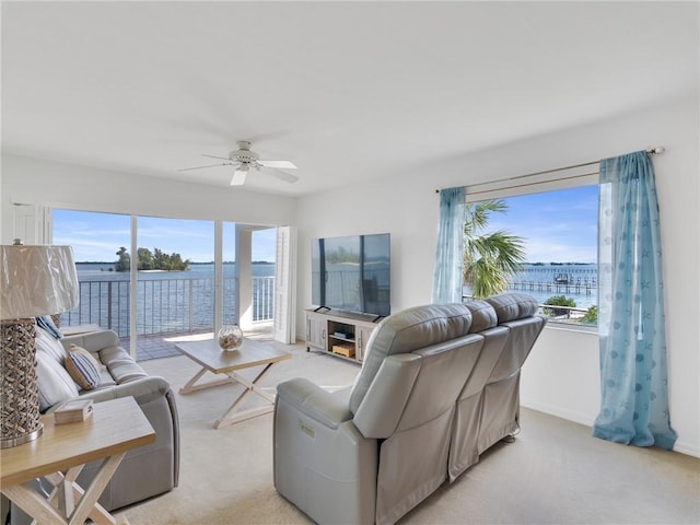 carpeted living room featuring ceiling fan