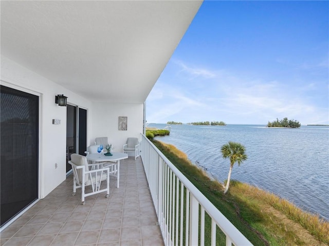 balcony featuring a water view