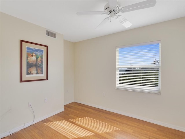 spare room featuring ceiling fan and wood-type flooring