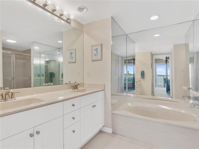 bathroom featuring tile patterned flooring, vanity, ceiling fan, and independent shower and bath