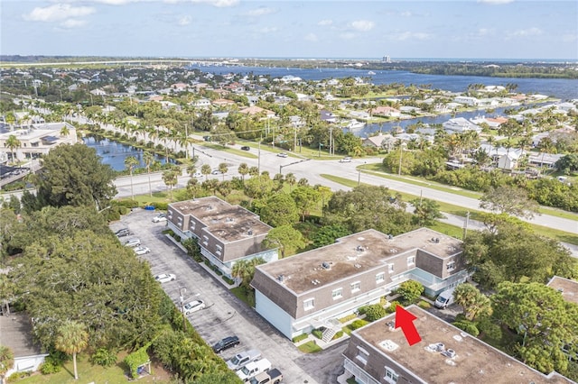 birds eye view of property with a water view