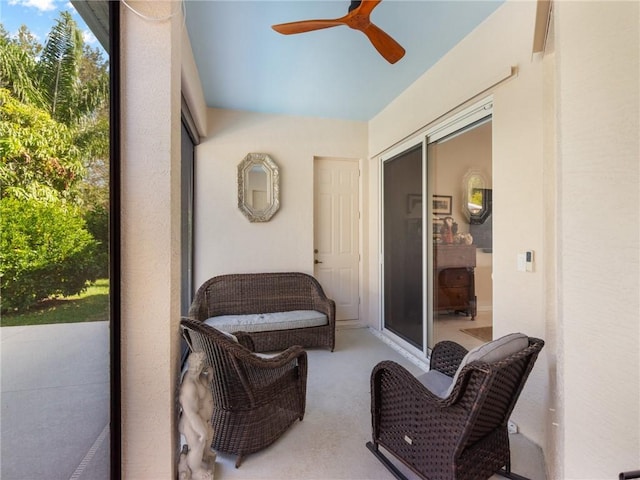 sunroom featuring ceiling fan