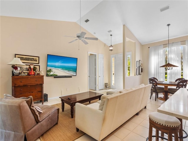 living room featuring vaulted ceiling, ceiling fan, and light tile patterned flooring