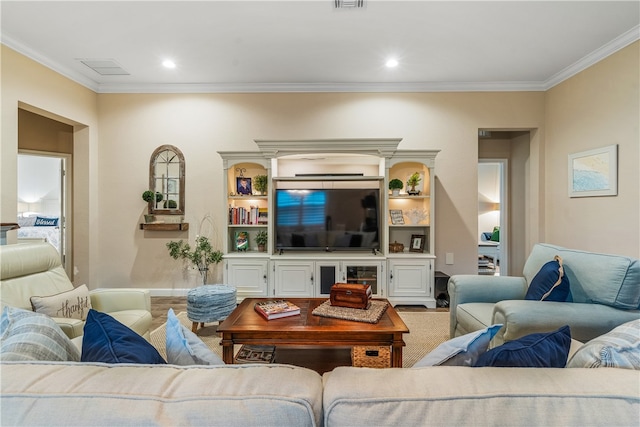 living room featuring crown molding