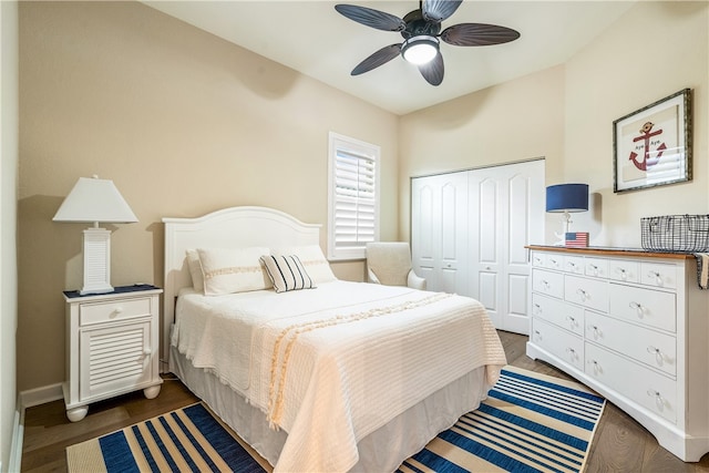 bedroom featuring dark hardwood / wood-style flooring, a closet, and ceiling fan