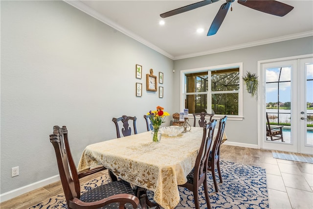 dining room featuring ornamental molding, ceiling fan, and light hardwood / wood-style floors