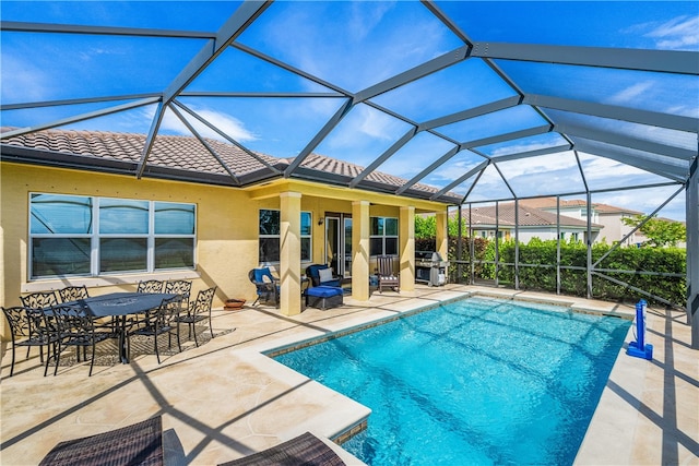 view of pool featuring a grill, glass enclosure, and a patio