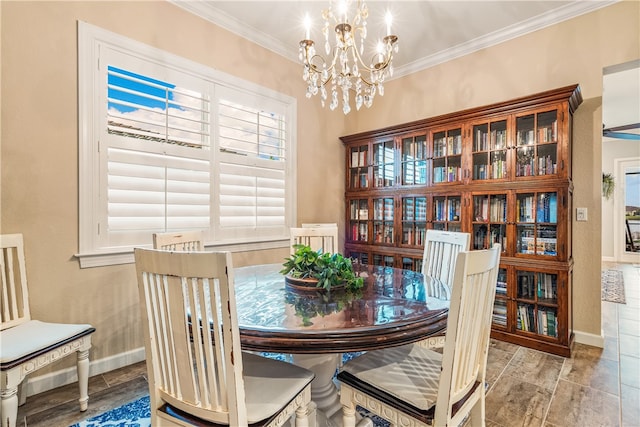 dining area featuring a wealth of natural light, a notable chandelier, and ornamental molding