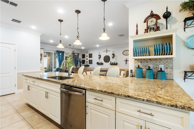 kitchen featuring stainless steel dishwasher, sink, light stone counters, and ornamental molding