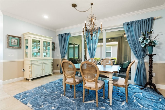 tiled dining room with ornamental molding and ceiling fan with notable chandelier