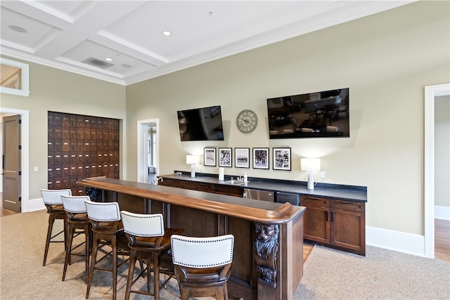 bar featuring light colored carpet, dark brown cabinetry, coffered ceiling, ornamental molding, and beamed ceiling