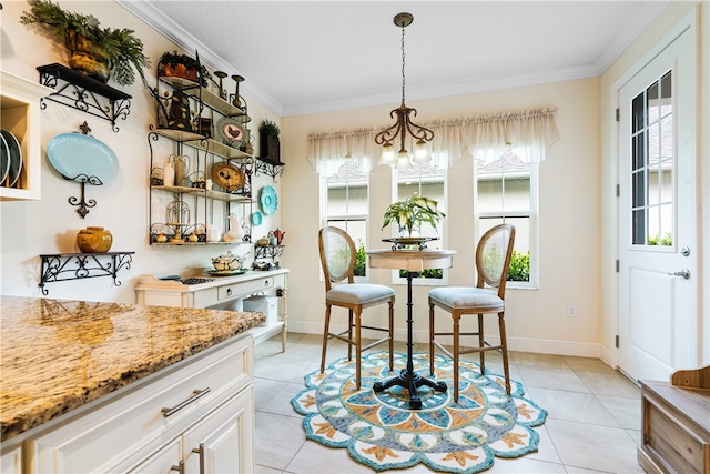 dining area with light tile patterned flooring, a chandelier, and crown molding