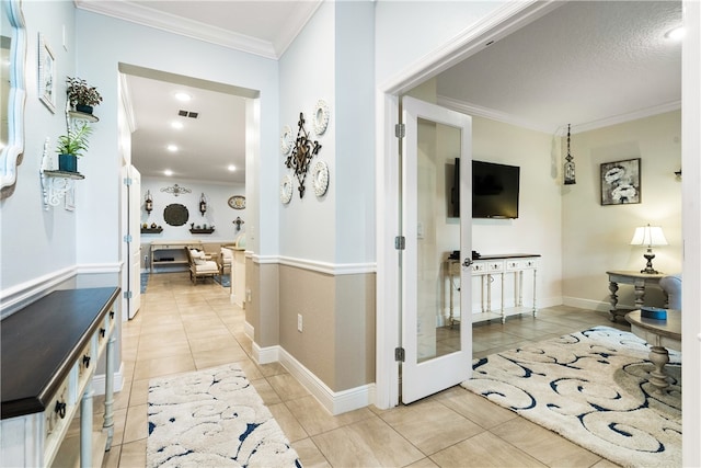 corridor featuring light tile patterned flooring and ornamental molding