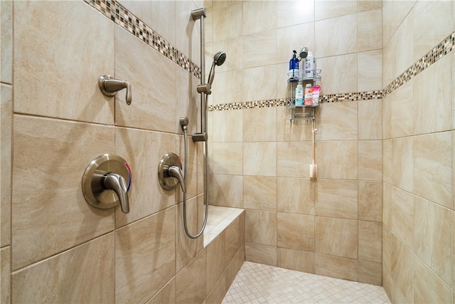 bathroom with tiled shower