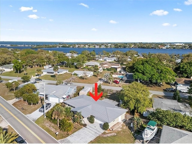 aerial view with a residential view and a water view