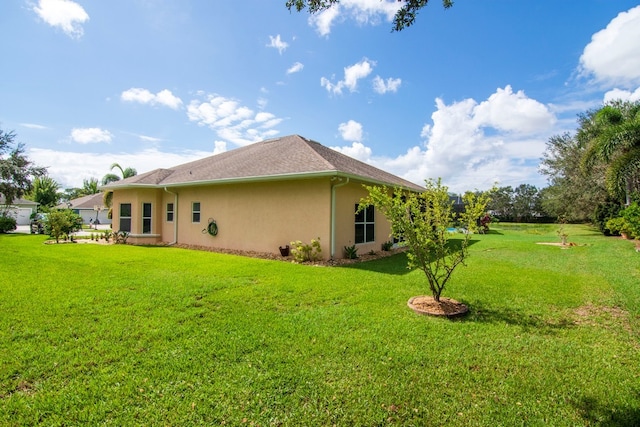 view of property exterior with a yard