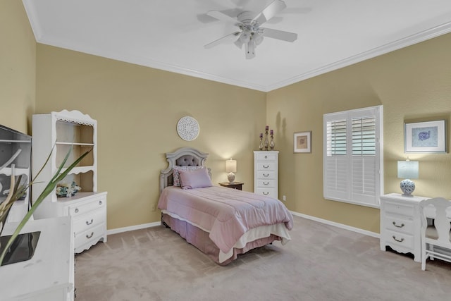 bedroom featuring ornamental molding, light carpet, and ceiling fan