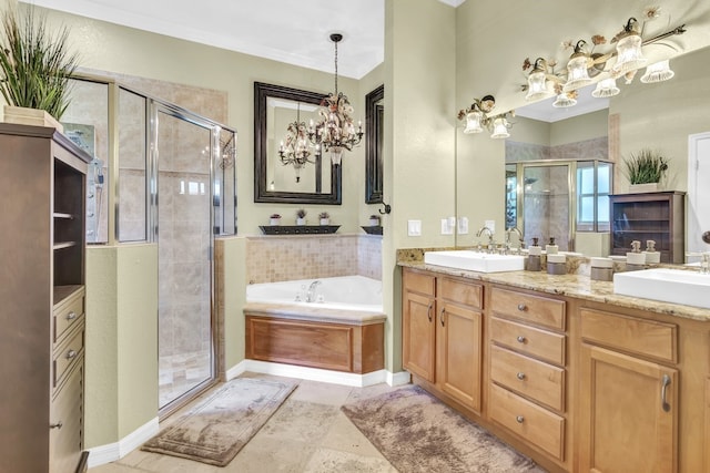 bathroom featuring a notable chandelier, vanity, and independent shower and bath