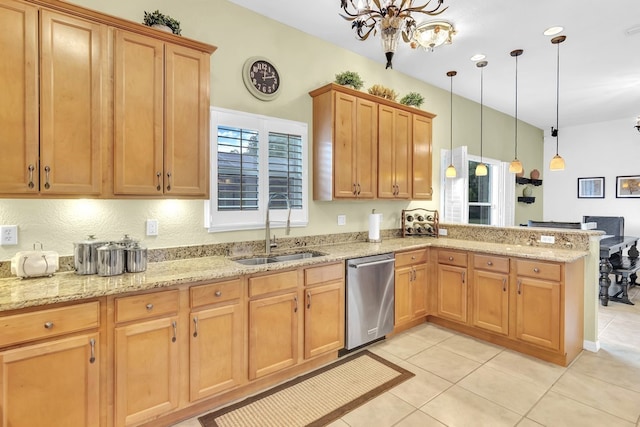 kitchen with light tile patterned flooring, hanging light fixtures, sink, dishwasher, and kitchen peninsula