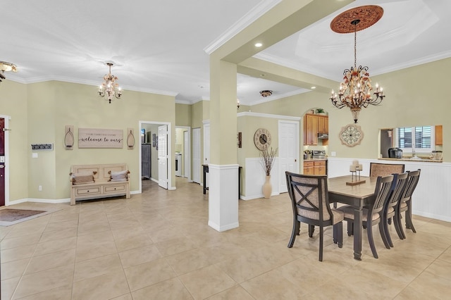 dining area featuring light tile patterned floors, a notable chandelier, and ornamental molding