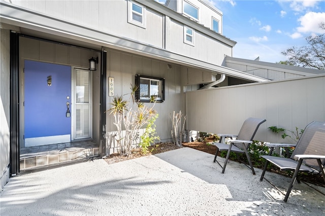 entrance to property featuring a patio area