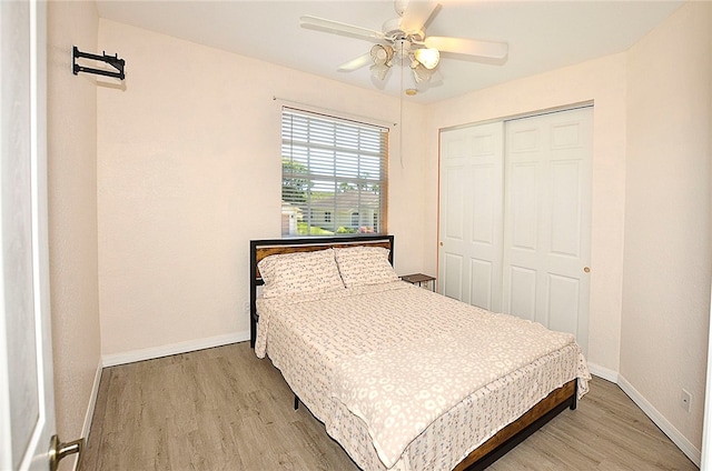 bedroom featuring a closet, ceiling fan, and light hardwood / wood-style floors