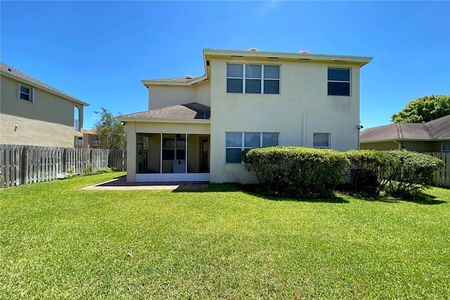 back of property featuring a patio area and a yard