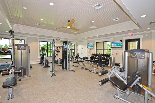 exercise room featuring a tray ceiling, wood ceiling, ceiling fan, and crown molding