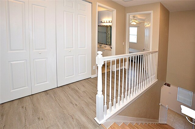 hallway featuring wood-type flooring