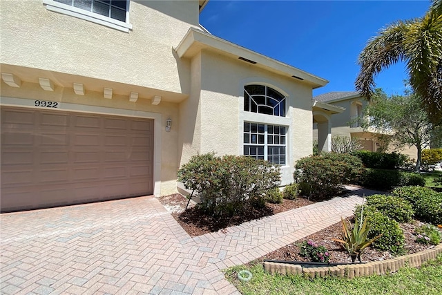 view of exterior entry featuring a garage