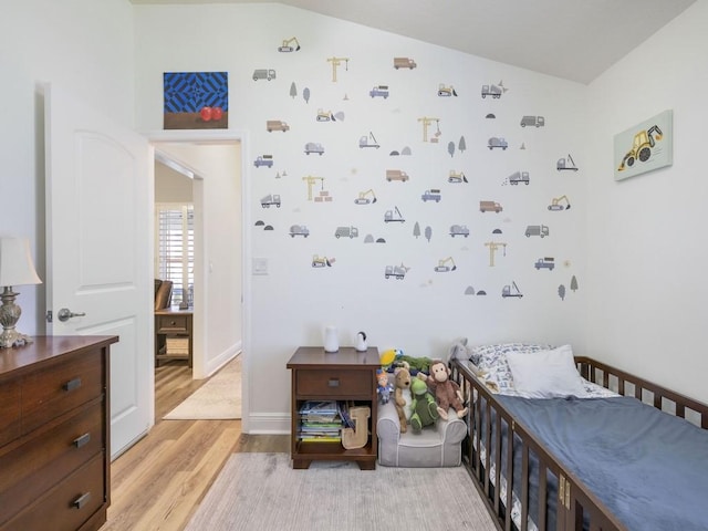 1206 Briarcliff Ct, Sebastian, FL 32958 - bedroom with light wood-type flooring, baseboards, and lofted ceiling