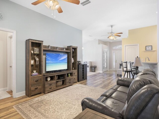 1206 Briarcliff Ct, Sebastian, FL 32958 - living room with ceiling fan, wood finished floors, and baseboards