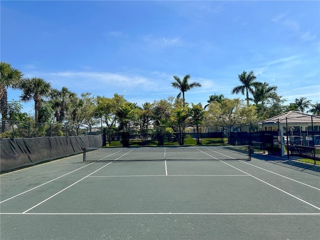 view of sport court with fence