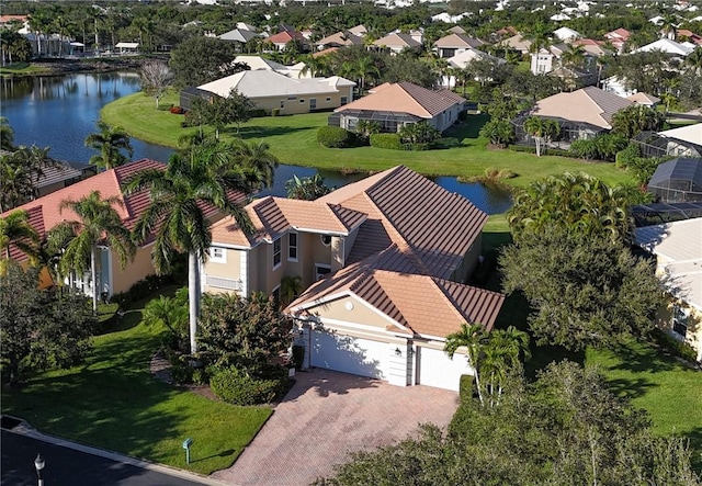 bird's eye view featuring a residential view and a water view