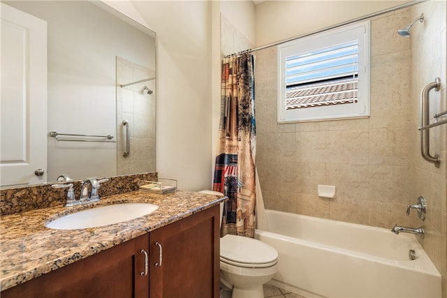 full bathroom featuring tile patterned flooring, vanity, toilet, and shower / tub combo