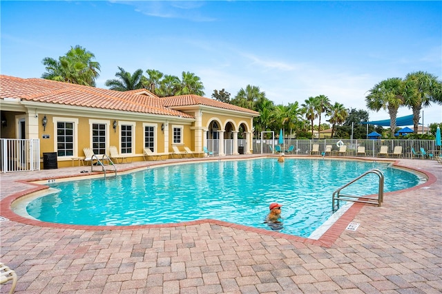 view of swimming pool featuring a patio