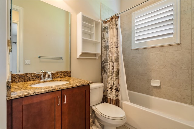 full bathroom featuring vanity, toilet, and shower / tub combo