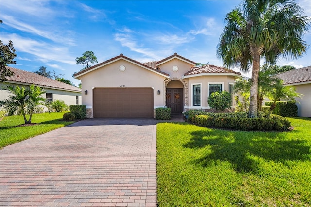 mediterranean / spanish-style home with a front lawn and a garage