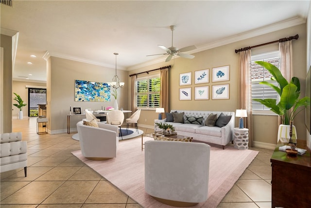 living room with ceiling fan with notable chandelier, light tile patterned floors, and crown molding