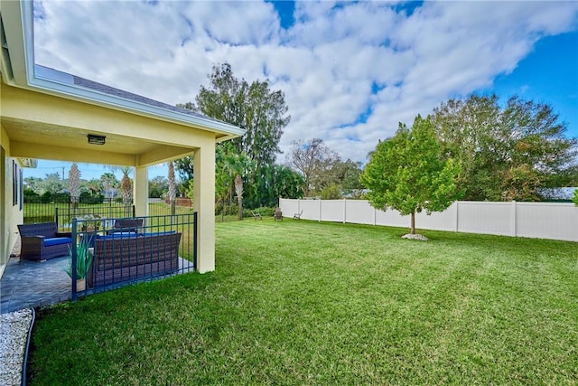 view of yard with a patio area and outdoor lounge area