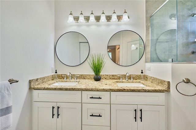 bathroom featuring walk in shower and vanity