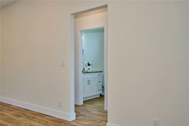 hall with light hardwood / wood-style floors