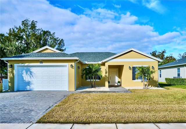 single story home with a garage and a front yard